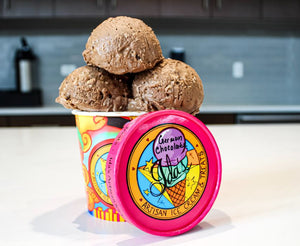 German chocolate ice cream scoops sitting in an Ida's Artisan Ice Cream cup
